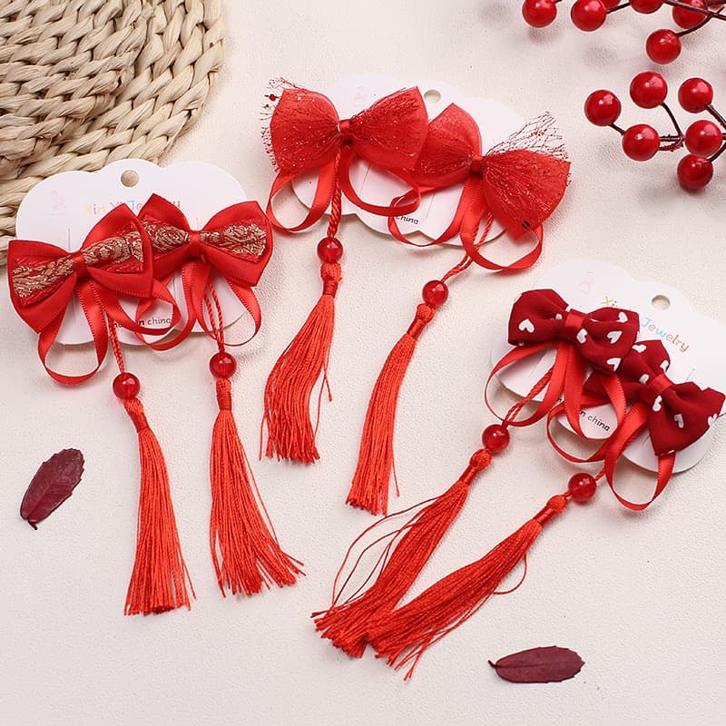 Babyonline(Y379)2F4 (ส่งด่วน1วัน)กิ๊ฟติดผมเด็กวันตรุษจีน1 เซ็ต 2 ชิ้น ประดับโบว์ พู่ ดอกไม้ - 1